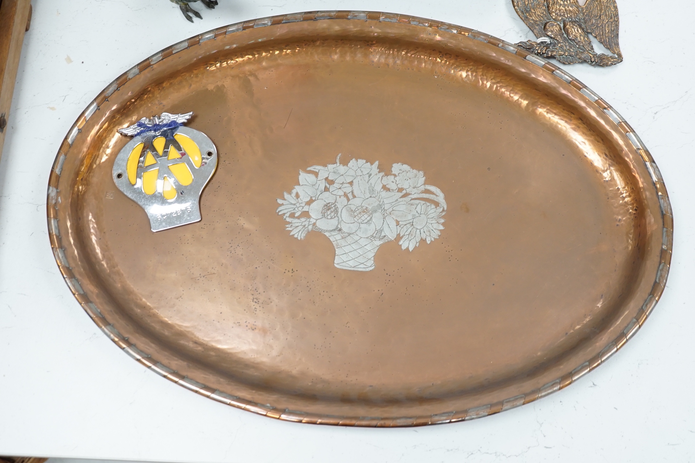 A large oval copper tray, cold-painted spelter parrot and four other items